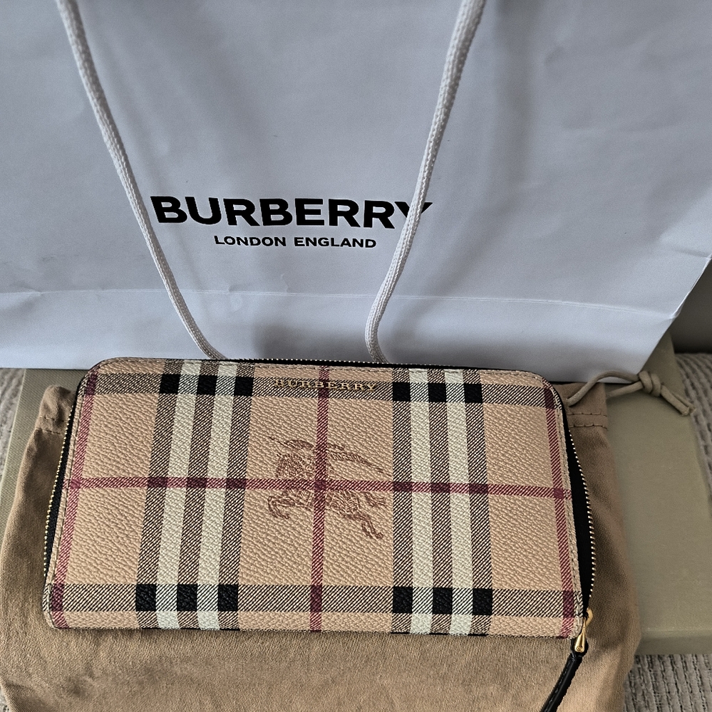 Burberry Haymarket wallet. Approximate measurements 7 1/2 W x 4 H. Great gift.